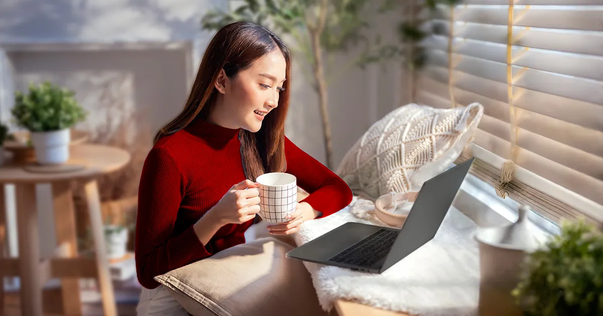 person working from home in a home office setup staying productive on laptop